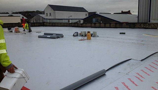 Insulated roof panels being laid at Supervalu, Cookstown